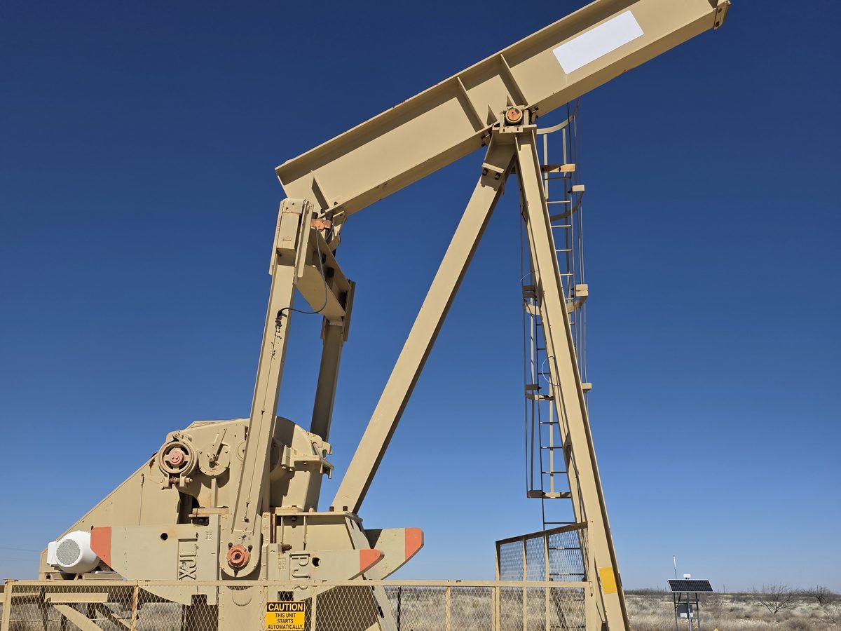 Conventional pumping unit standing on location in the Permian Basin