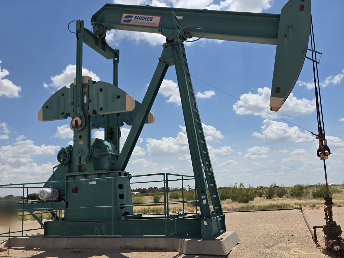 Teal Shores pumping unit under a cloudy sky
