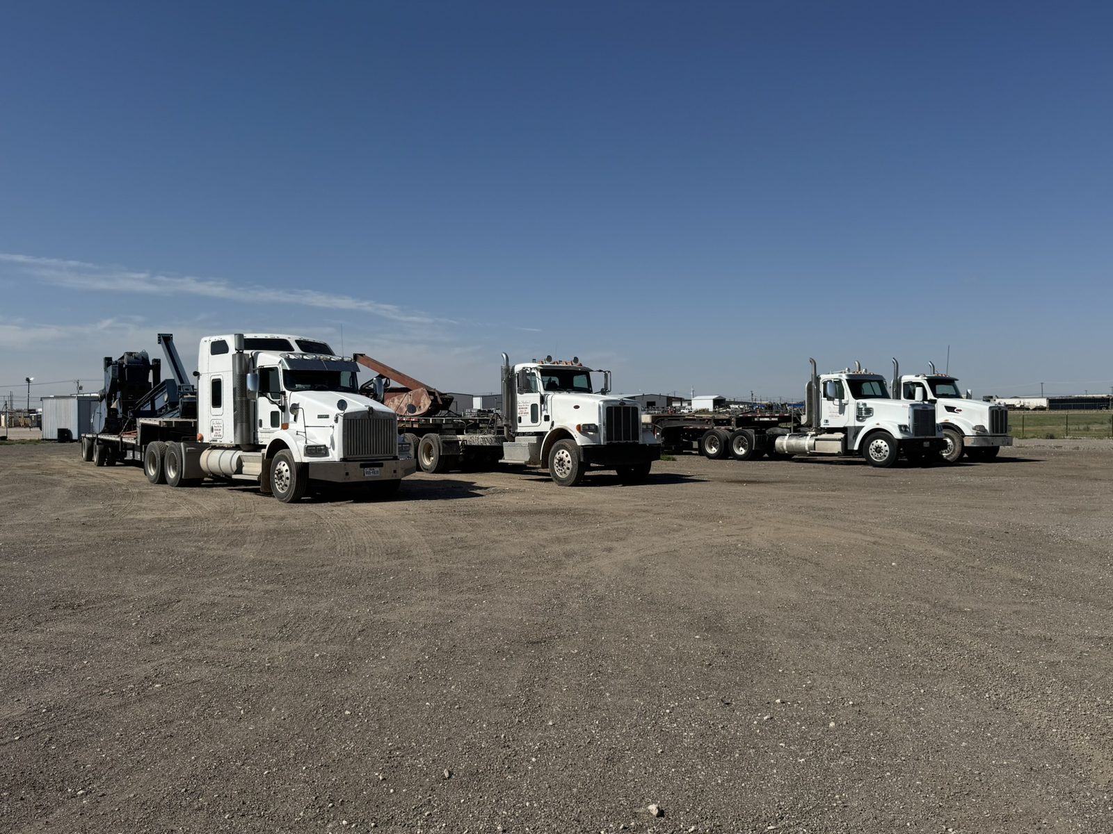 Snelson's trucks ready to haul and set pumping units, Midland TX