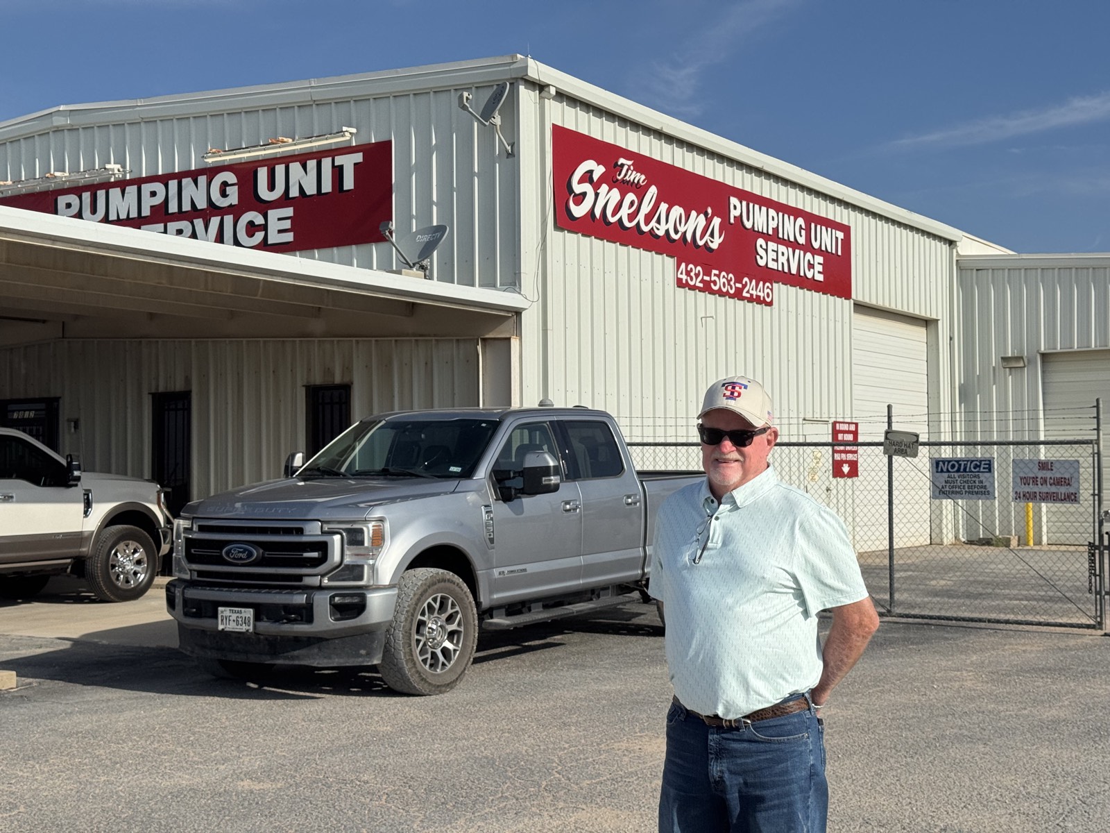 Tim Snelson in front of the Tim Snelson's Pumping Unit Service shop on Interstate 20 in Midland, Texas